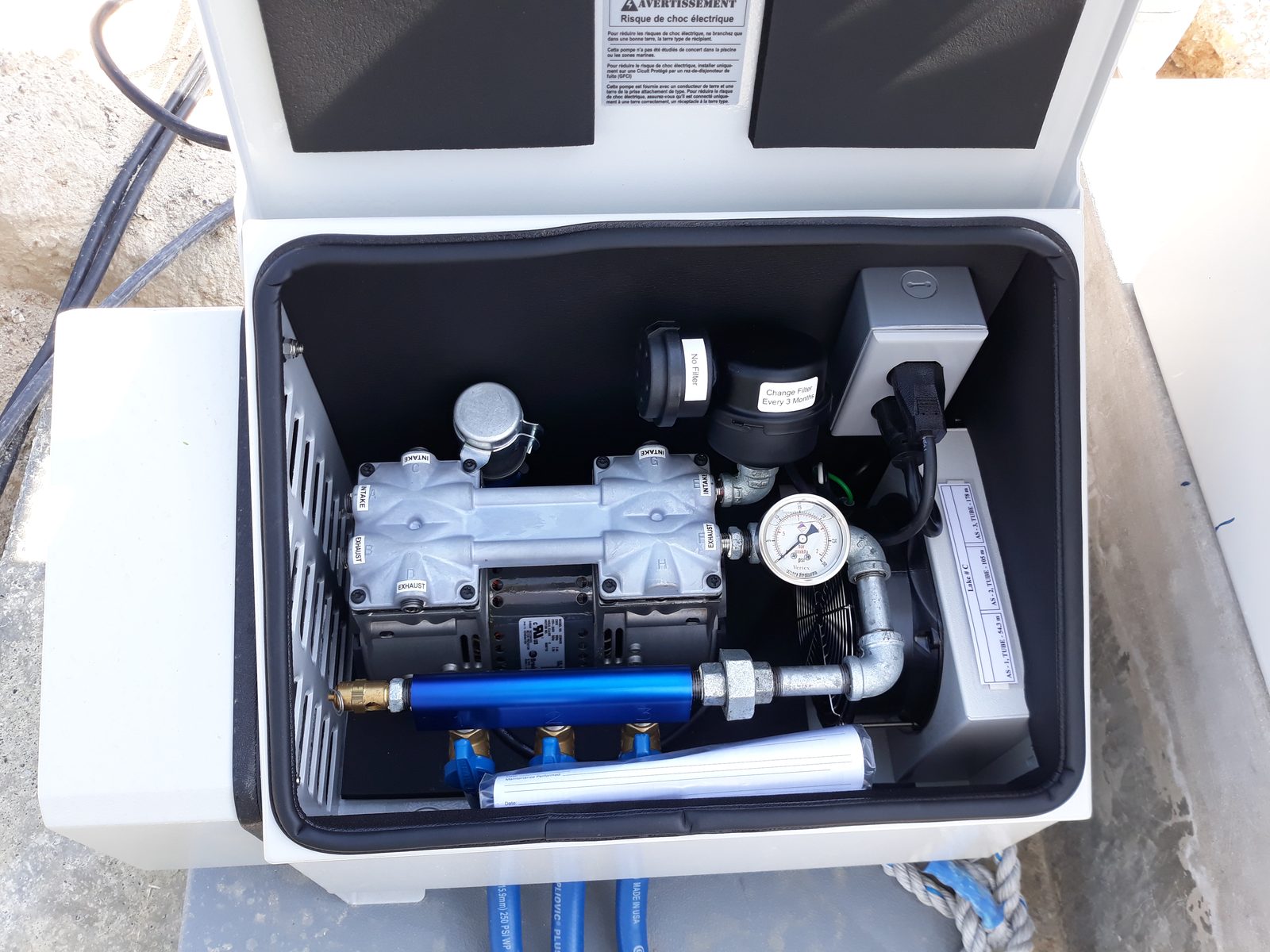 Vertex aeration compressor enclosure with air manifold and pressure gauge, installed by Alpha Environmental Solutions in the UAE